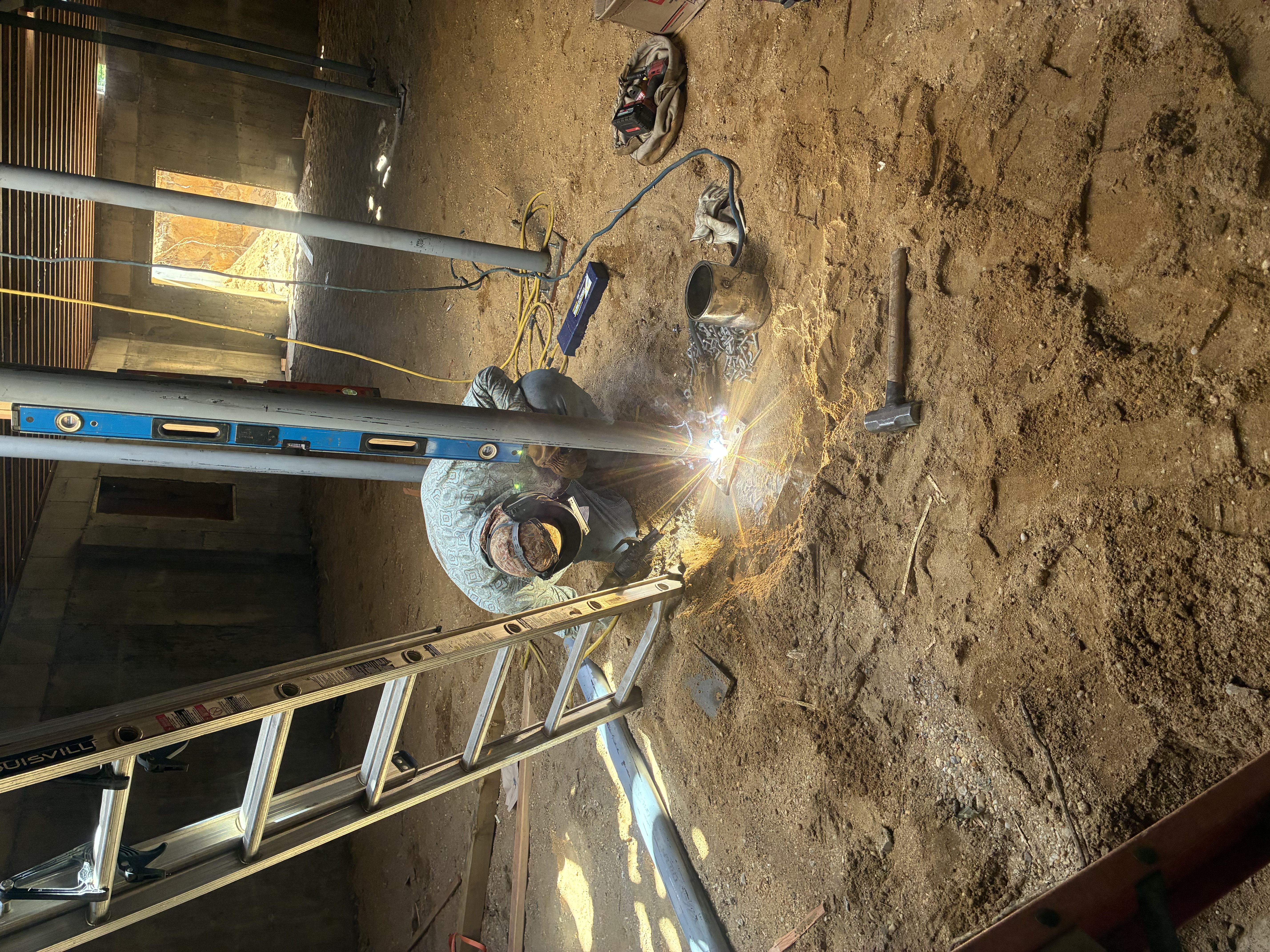 Welding sparks flying on steel trailer frame