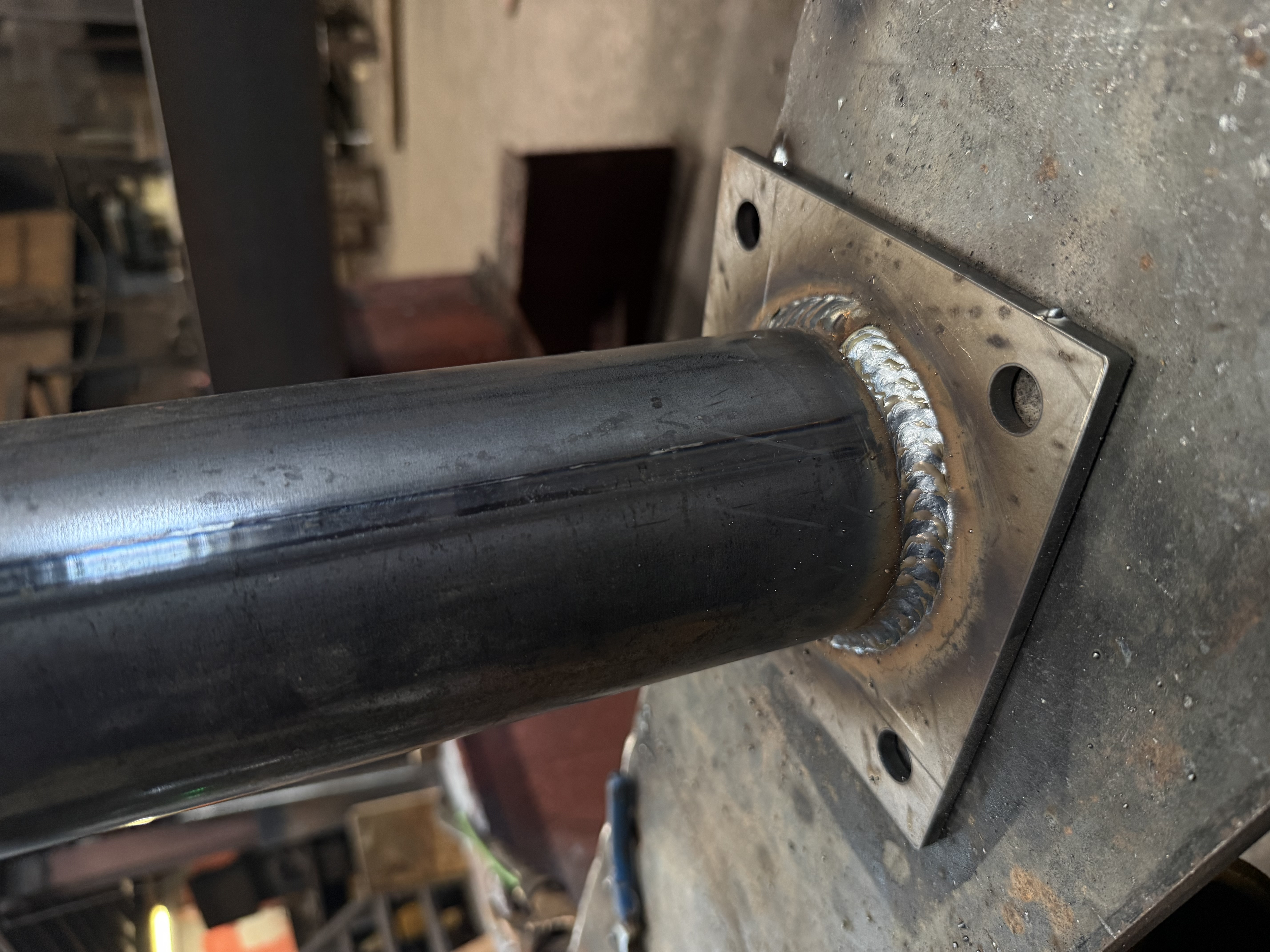 Pipe assembly with welded brackets and flanges