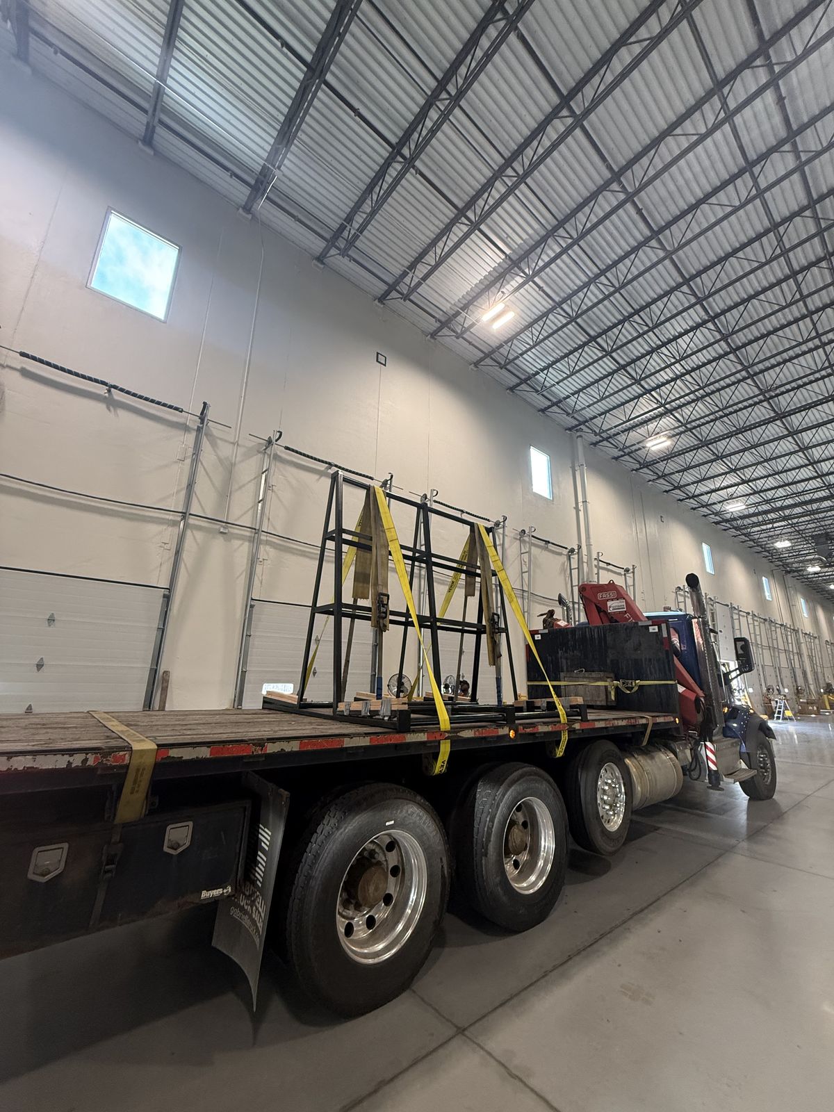 Custom steel slab A-frames mounted on a stone company flatbed truck