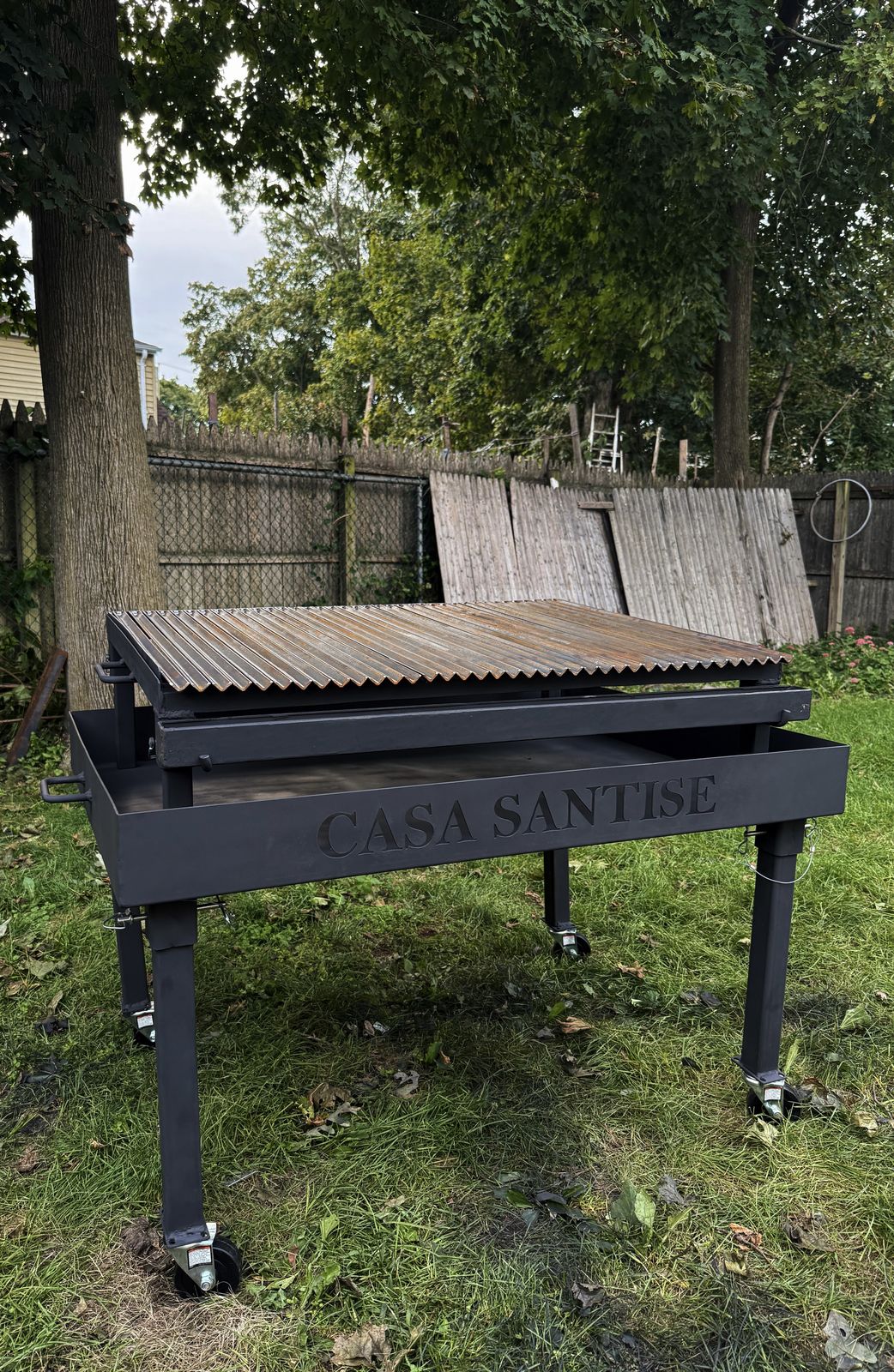 Custom Argentine-style parrilla grill on a steel frame