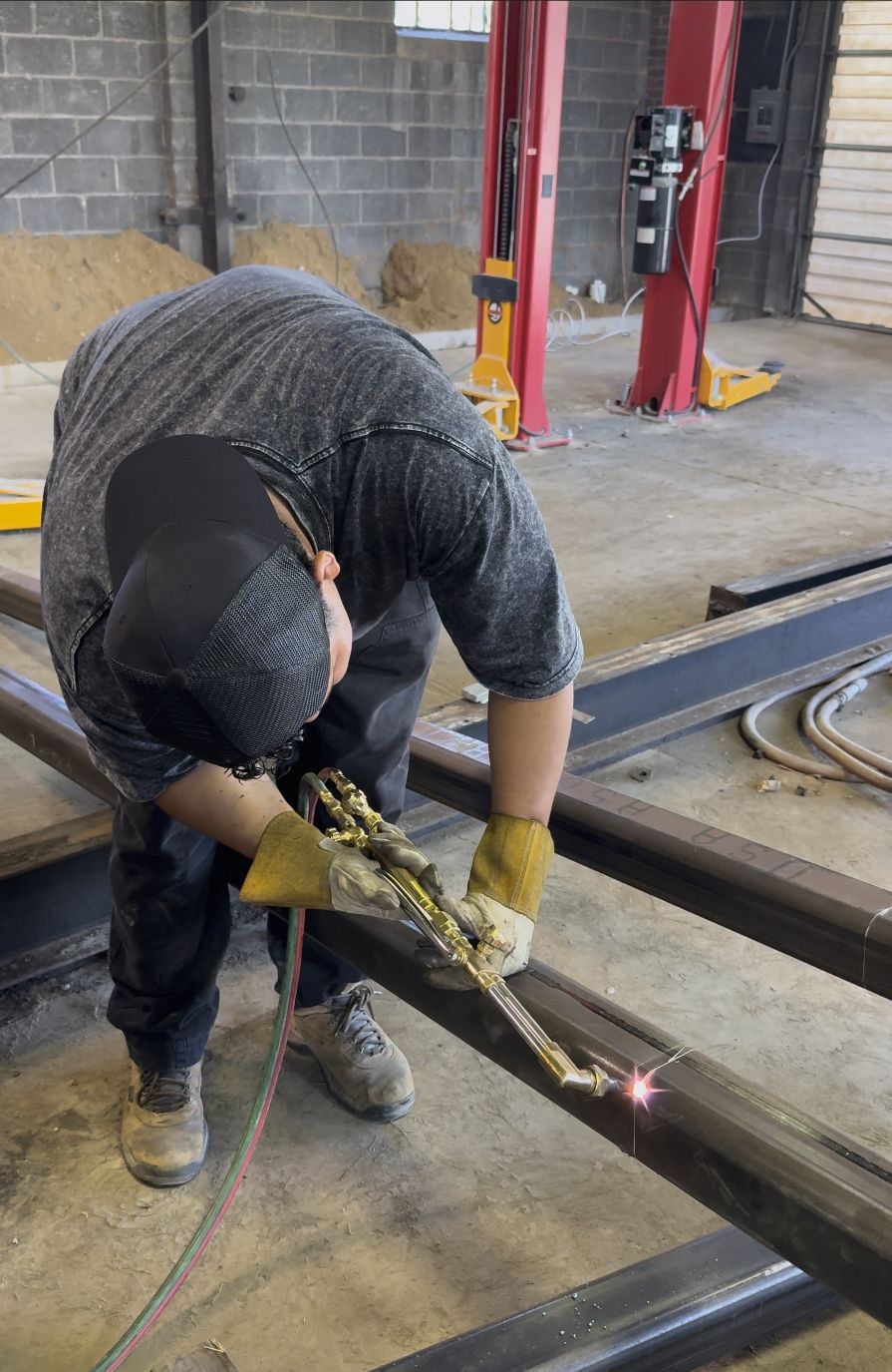 Torch-cutting a steel beam to length